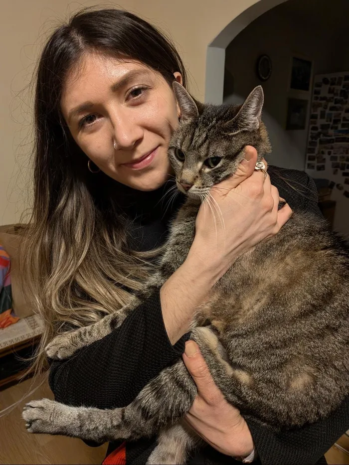Diana, with one of their adopted cats